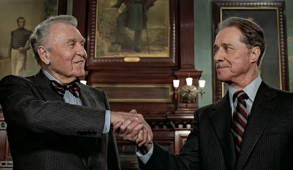 Ralph Bellamy as Randolph Duke and Don Ameche as Mortimer Duke shaking hands in Trading Places (1983)